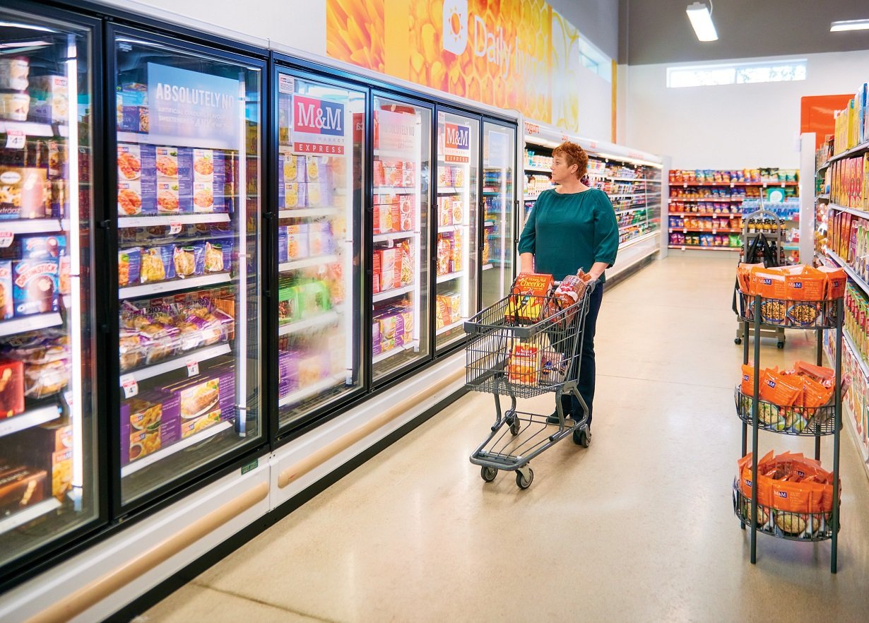 A freezer aisle inside and M&M Food Market Express location