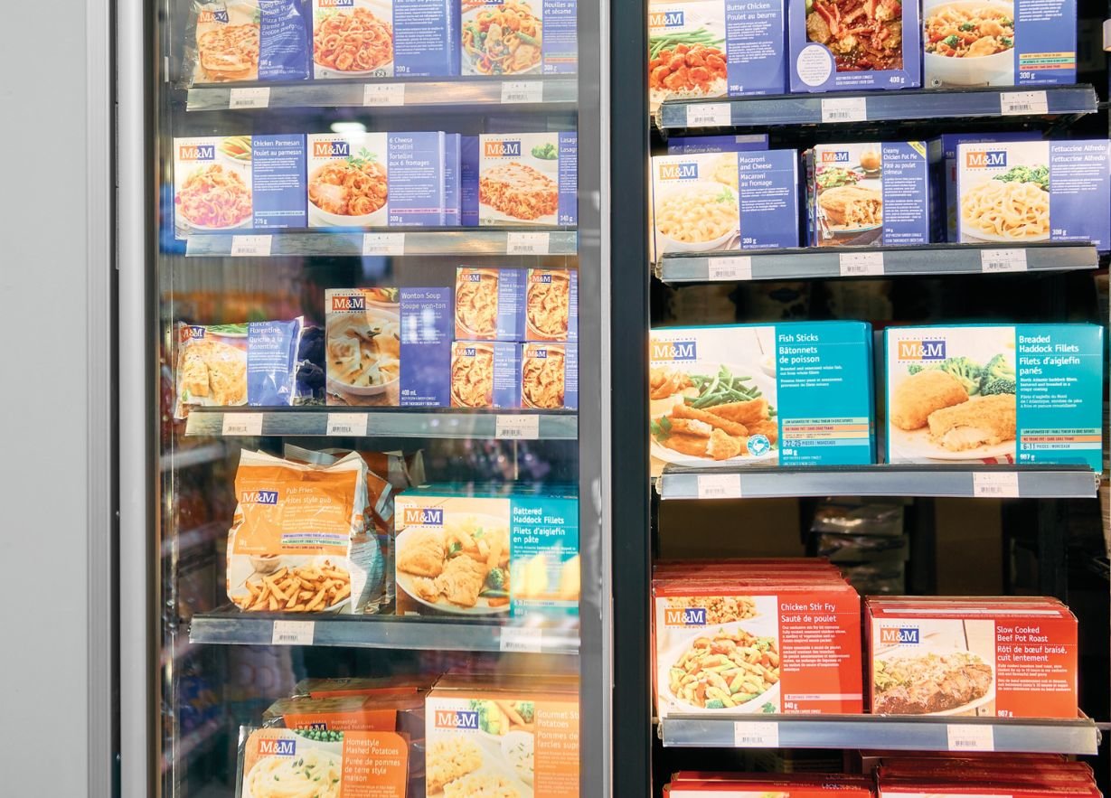 A freezer aisle inside and M&M Food Market Express location