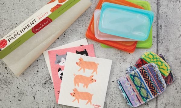 A kitchen counter full of serving accessories and utensils.